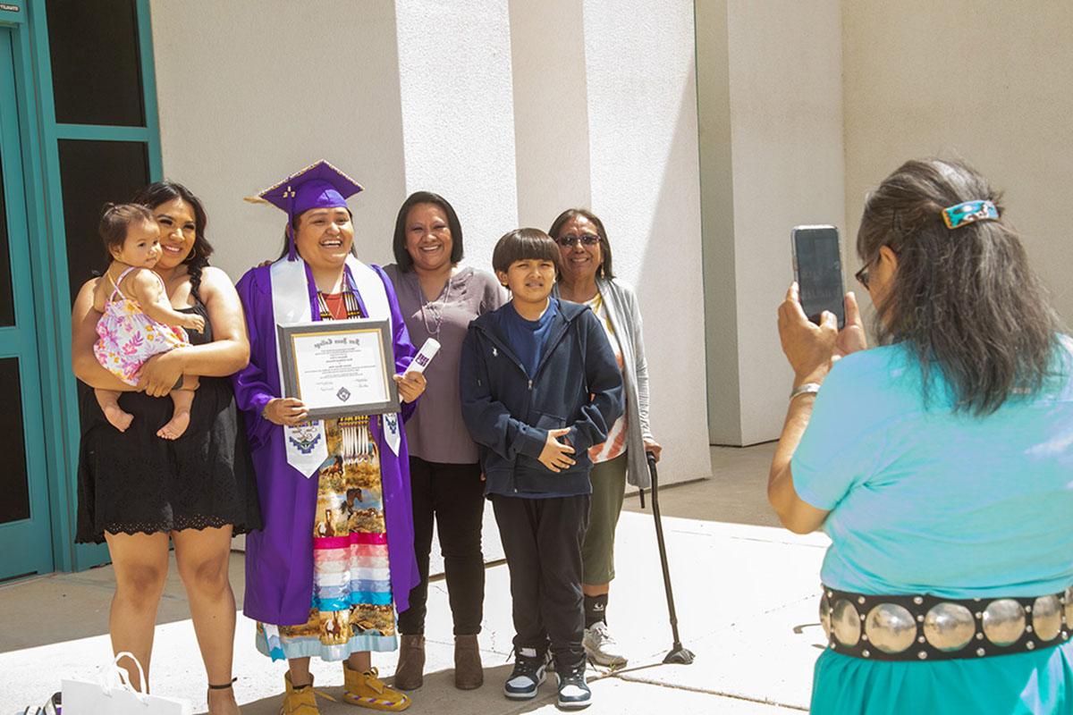 family of graduate celebrate and take photos together